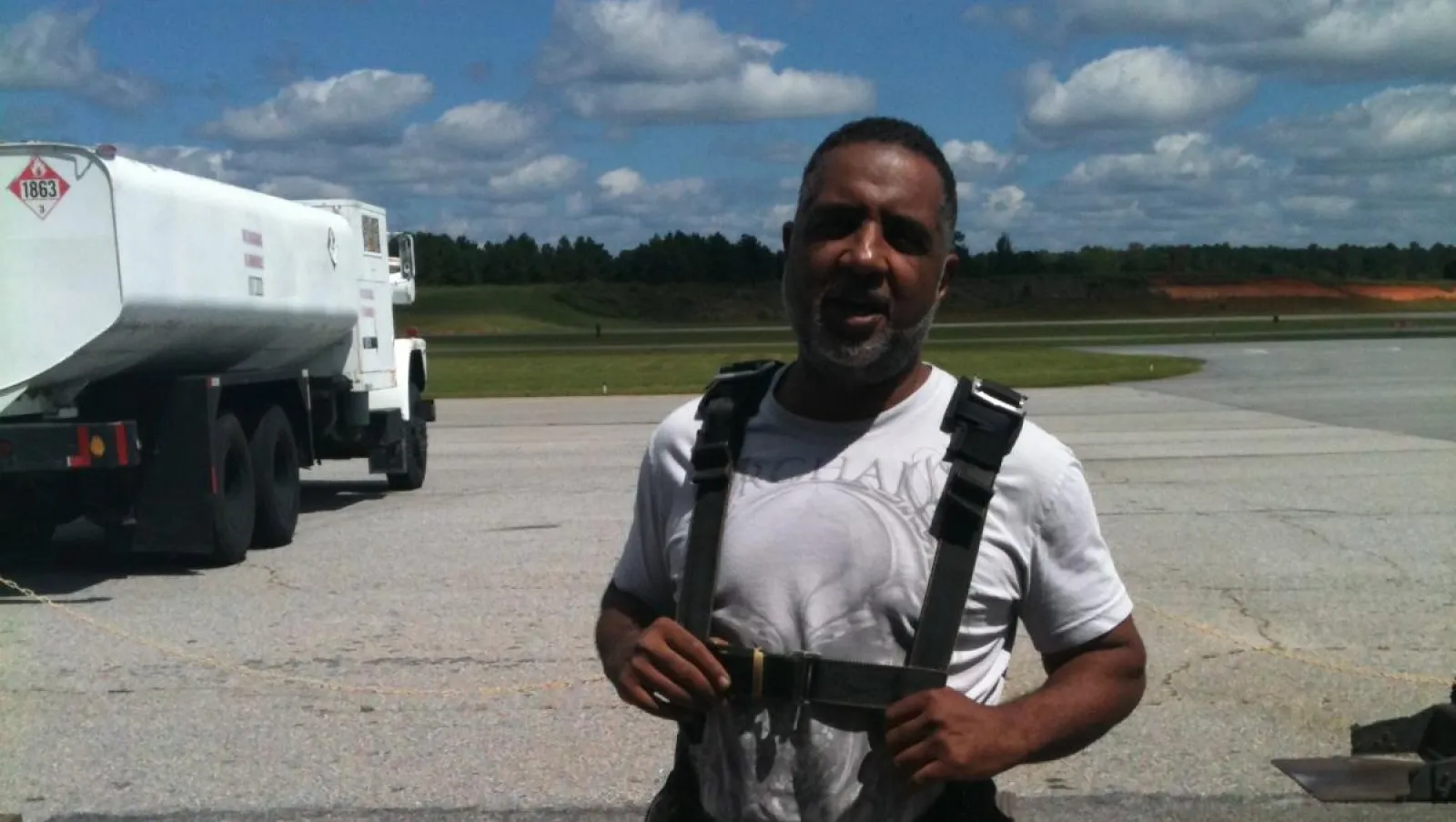 a man standing in front of a truck