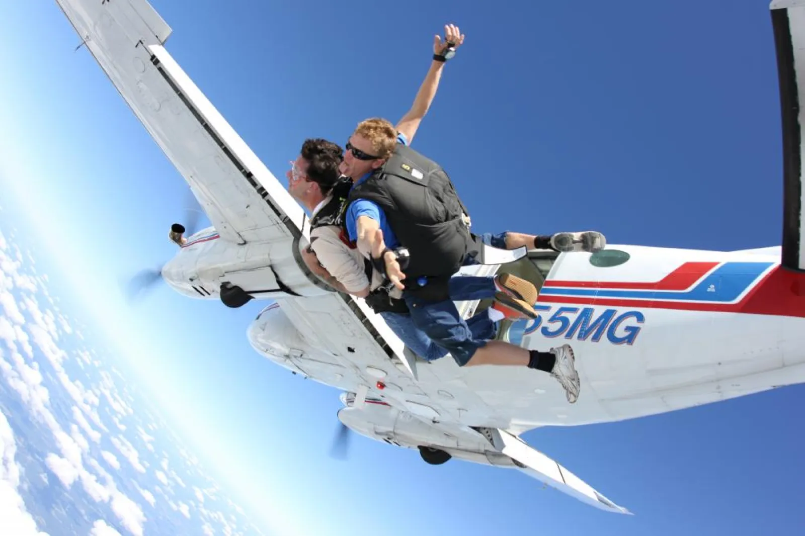 people jumping out of a plane