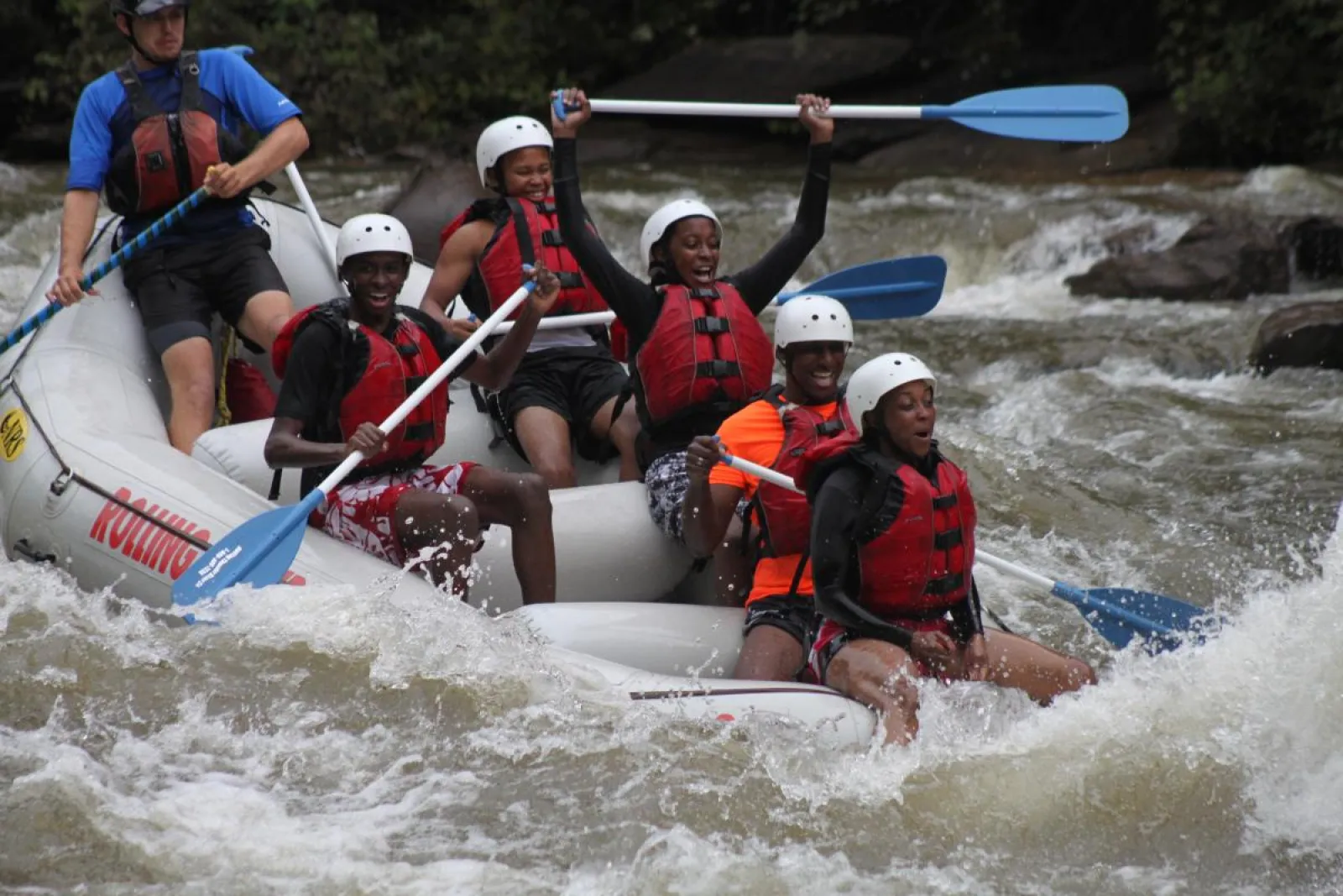 a group of people on a raft in the water