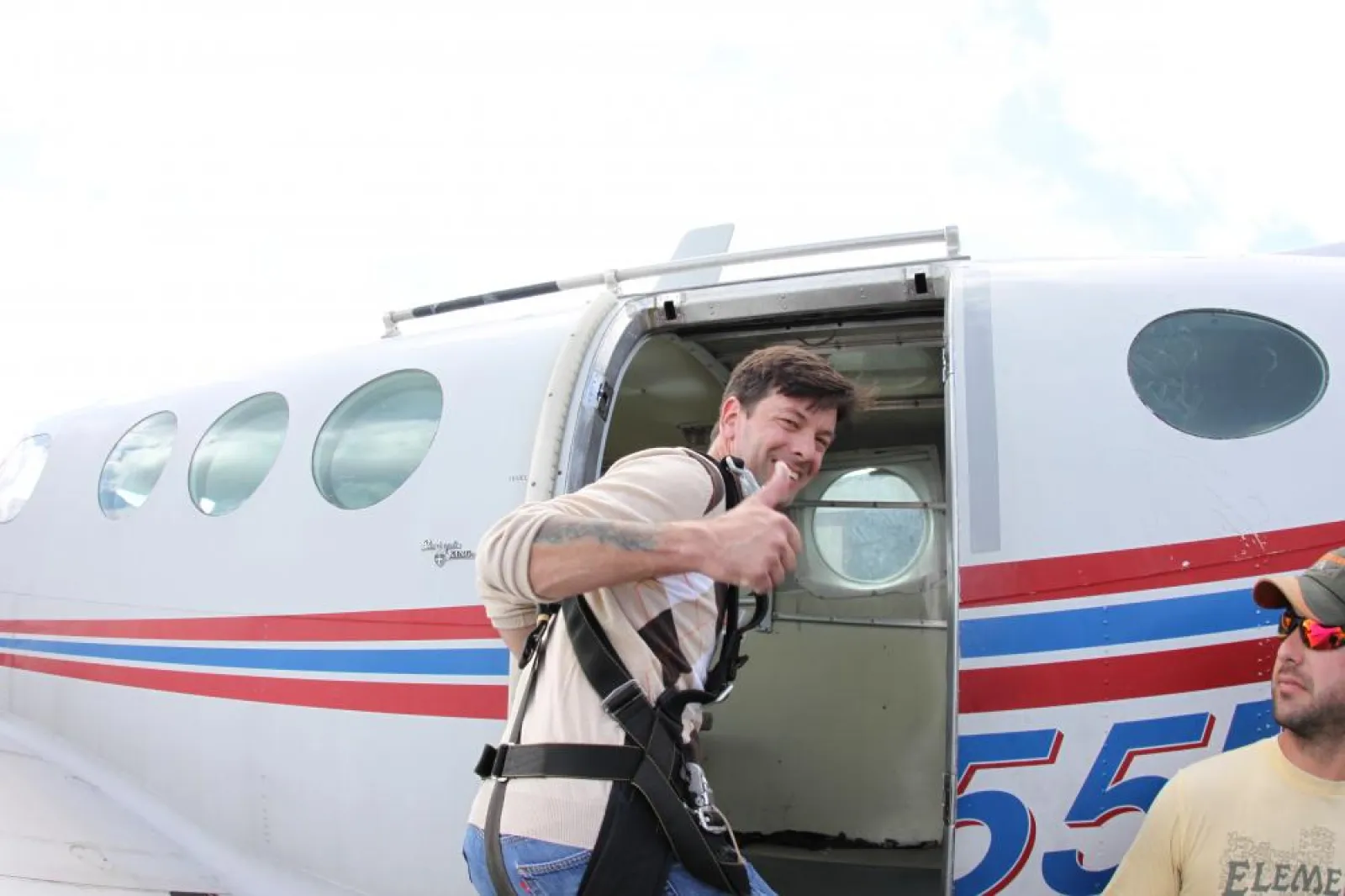 a man standing in front of a plane