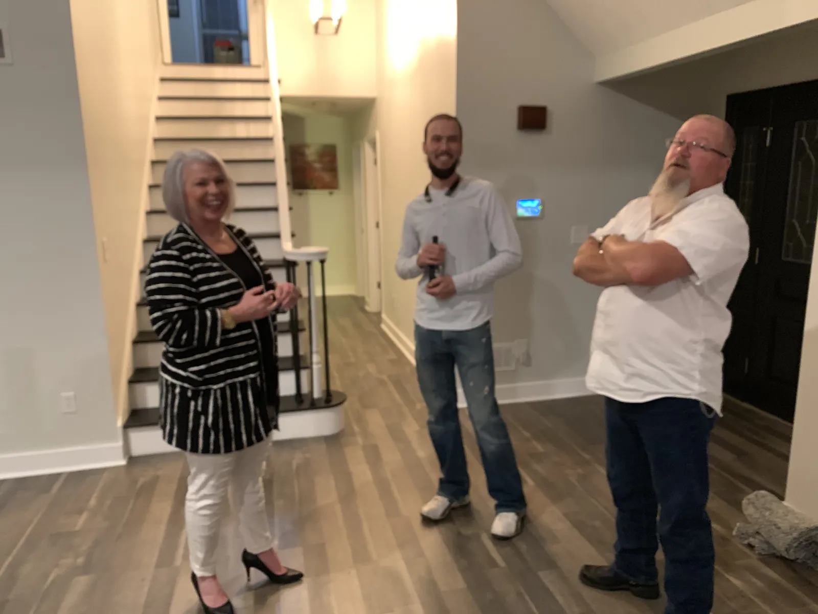 a group of people standing in a hallway