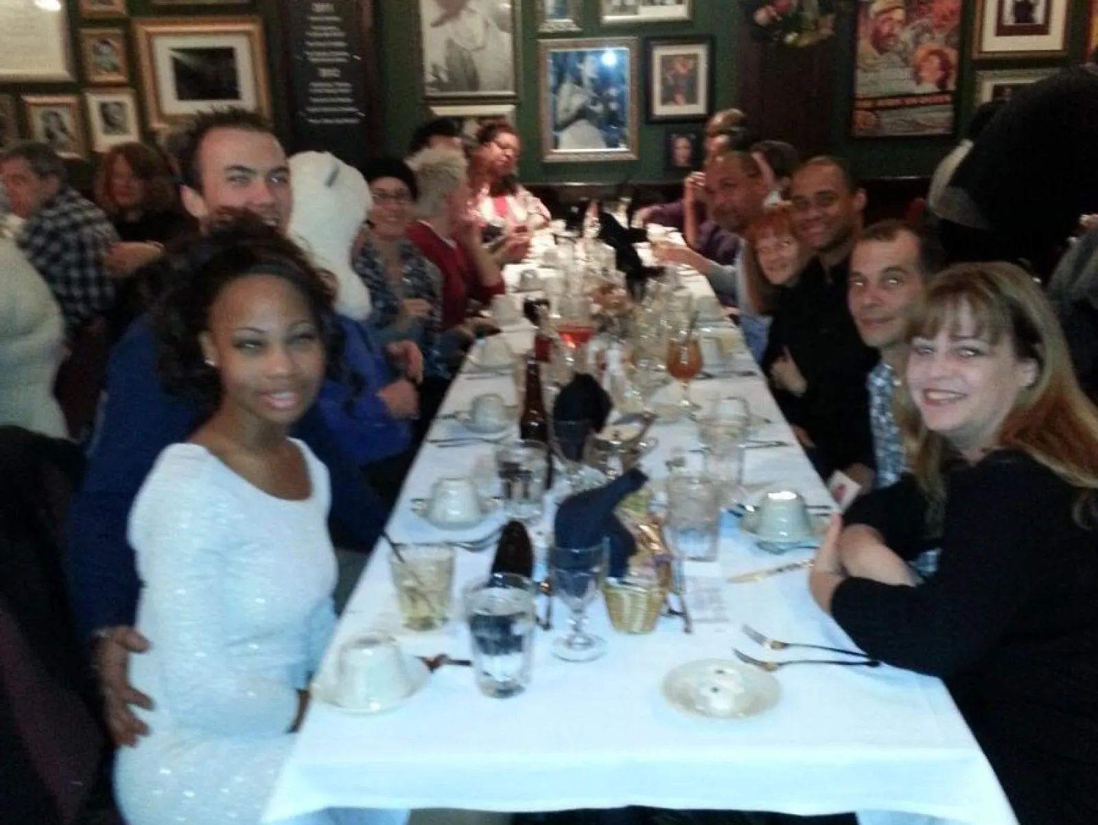 a group of people sitting at a table in a restaurant