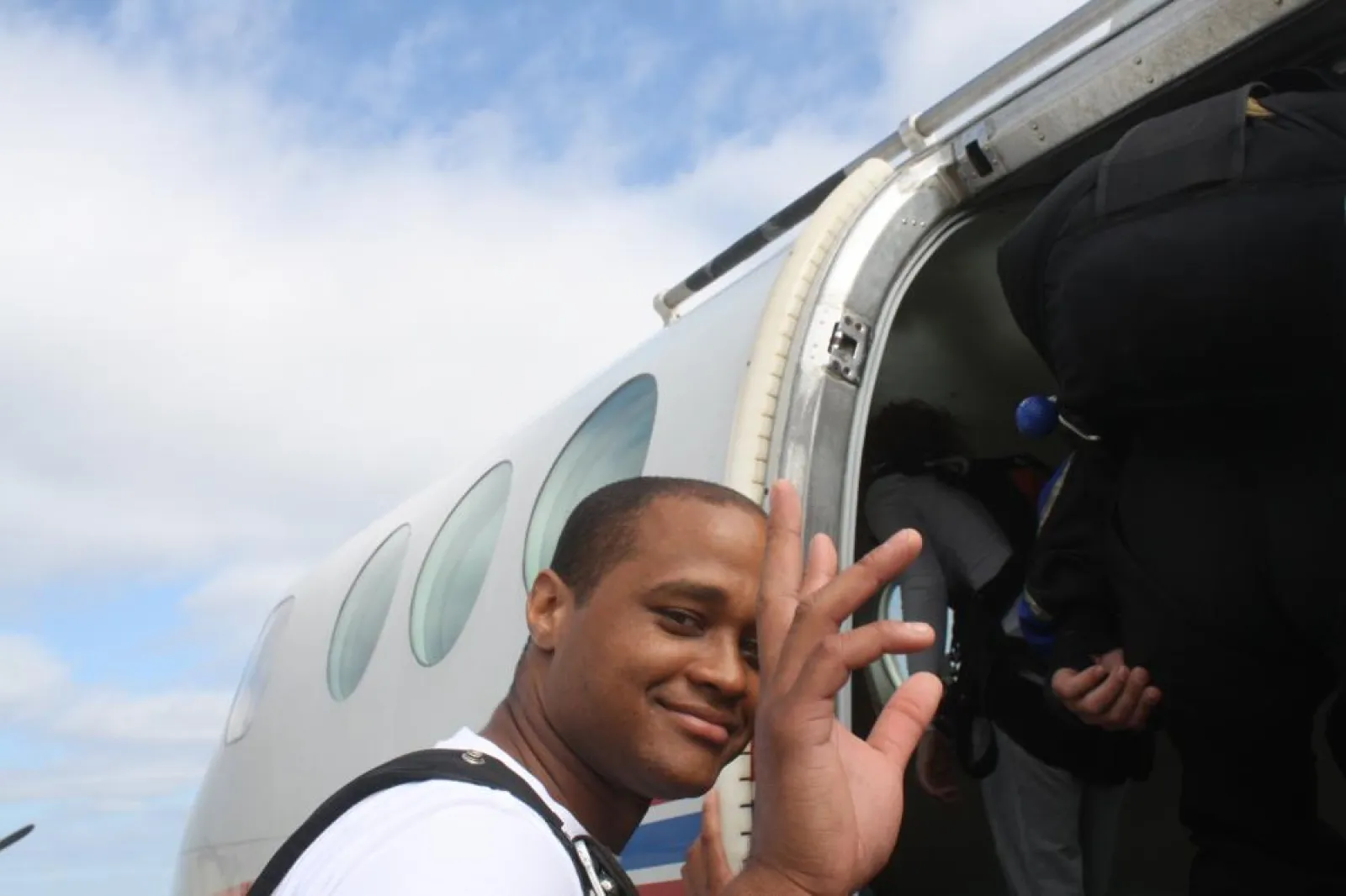 a man waving at the camera