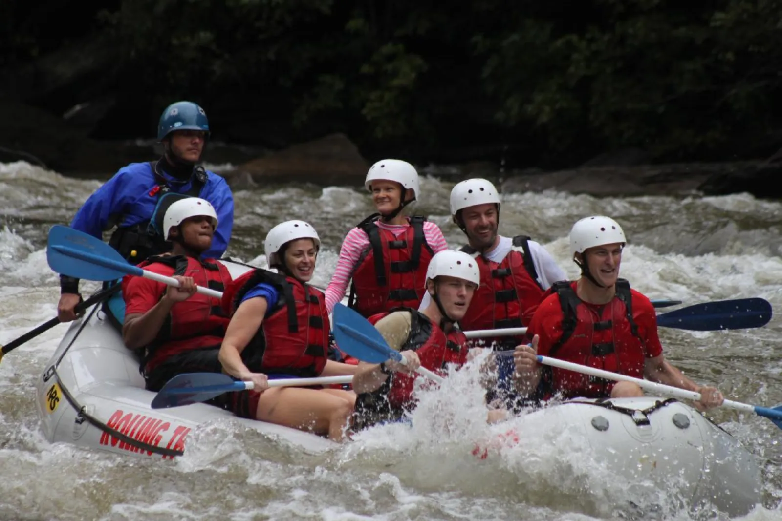 a group of people riding on a raft