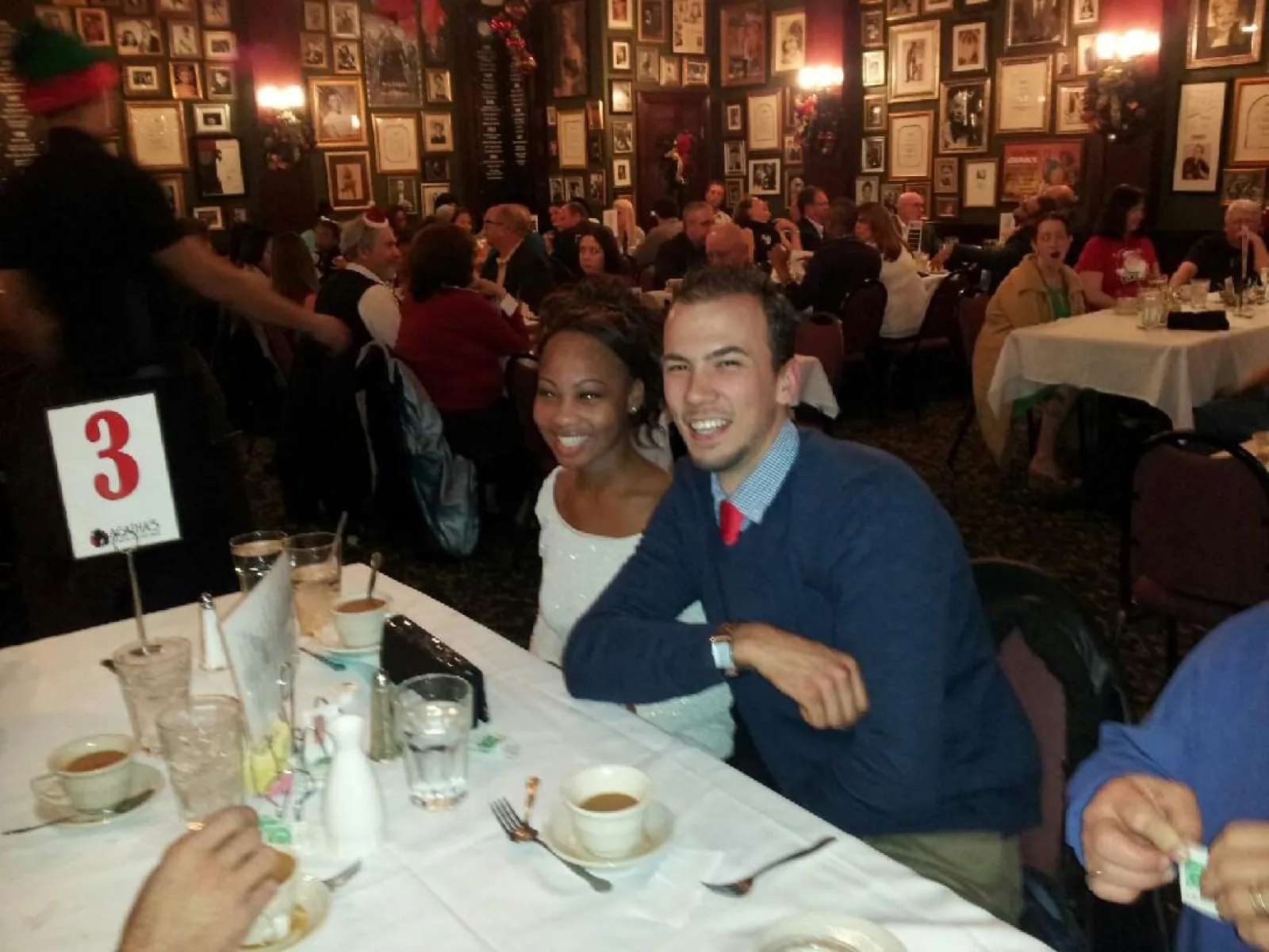 a group of people sitting at a table in a restaurant