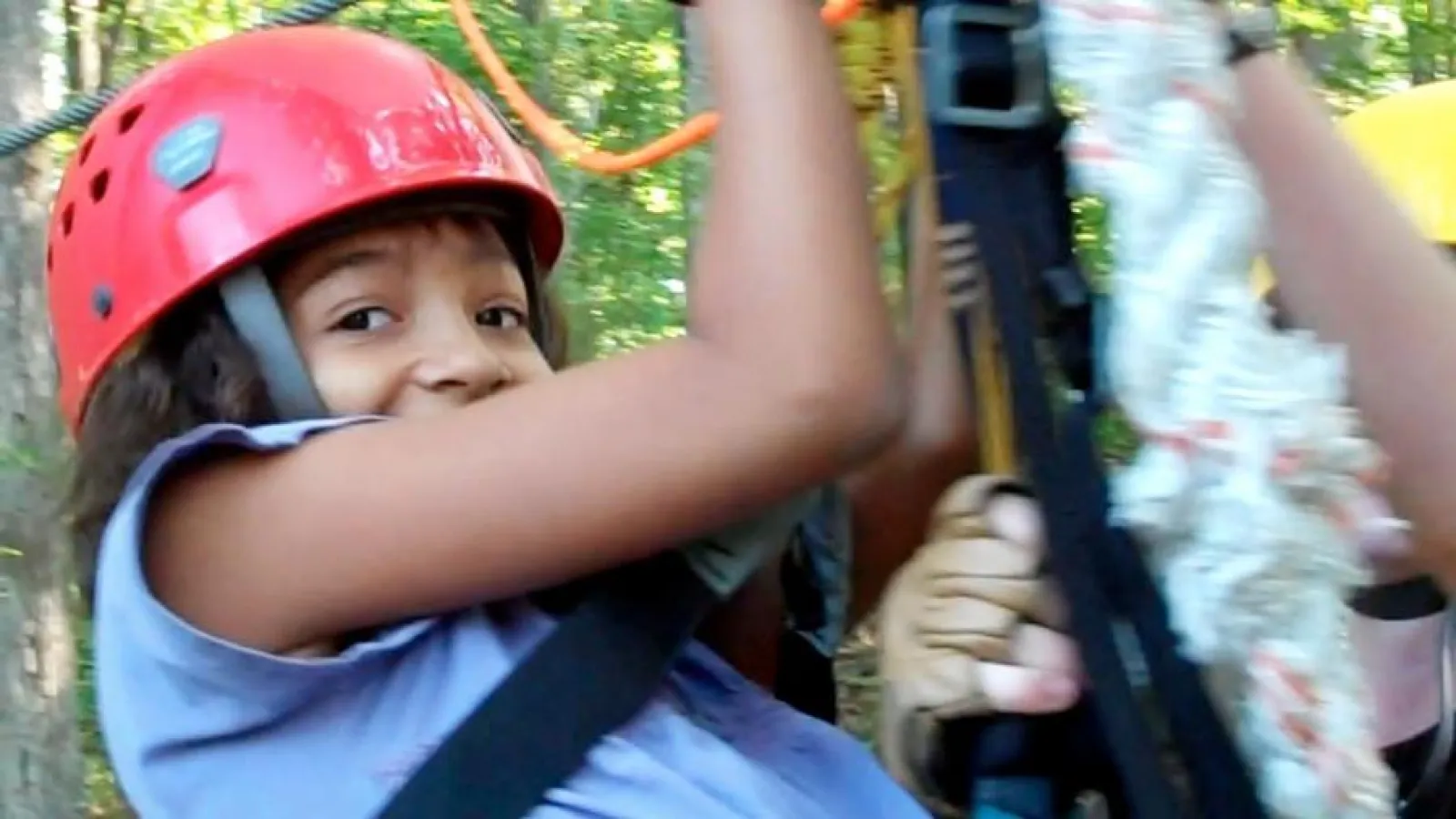 a close up of a child wearing a helmet