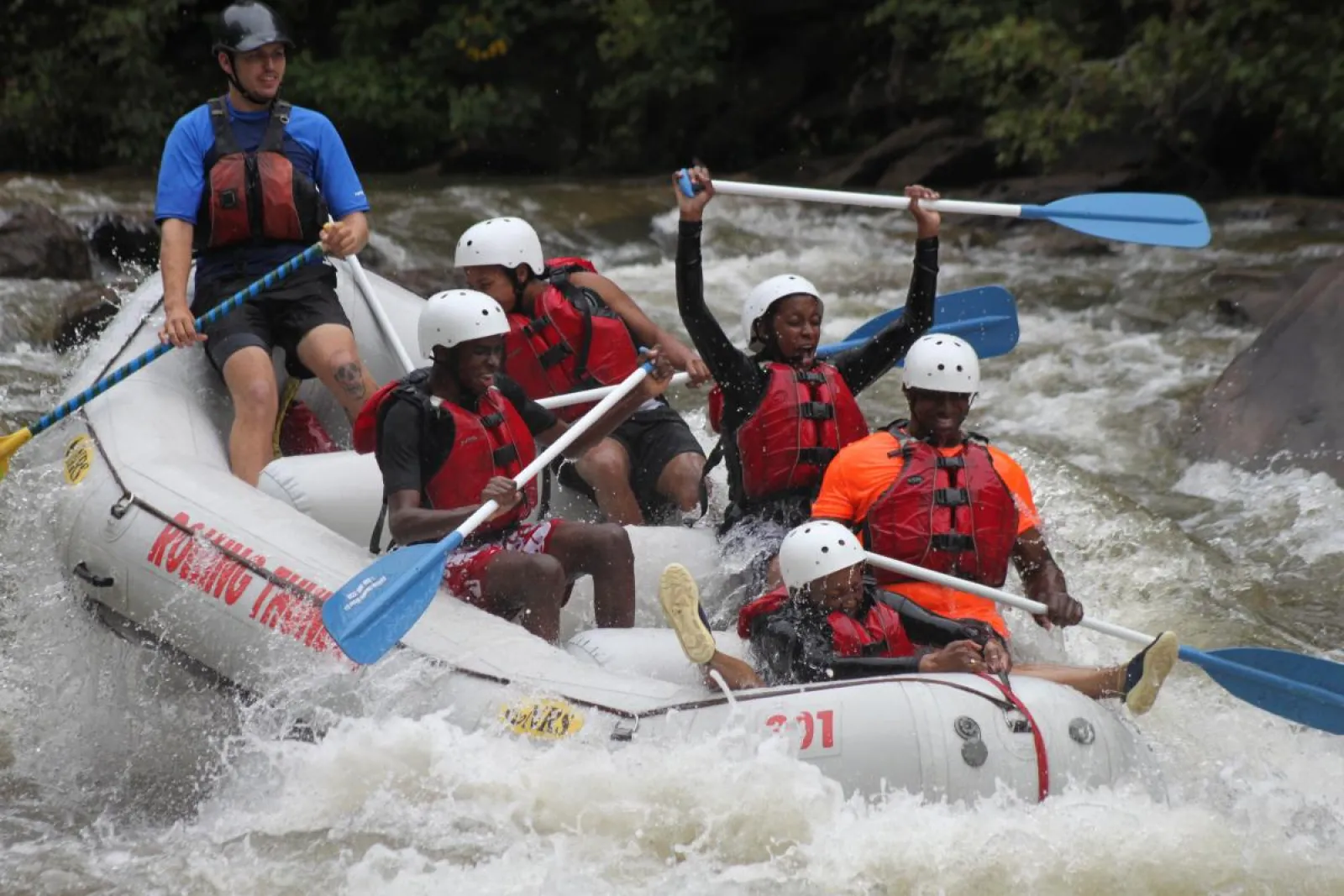 a group of people riding on a raft