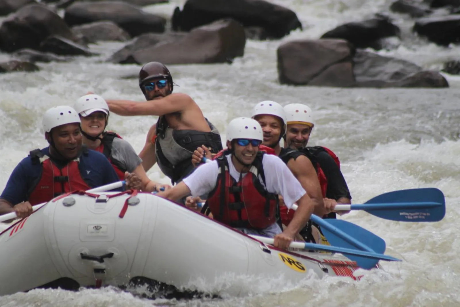 a group of people riding on a raft