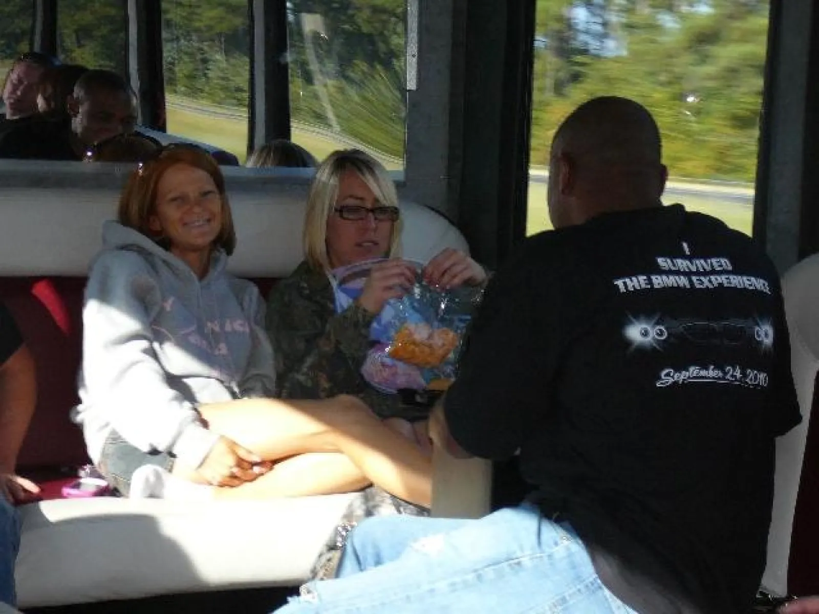 a group of people sitting on a bus