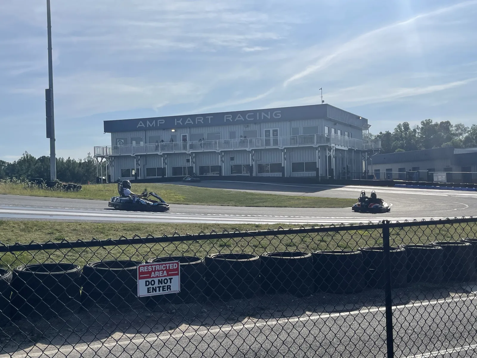 a group of people riding go karts on a track