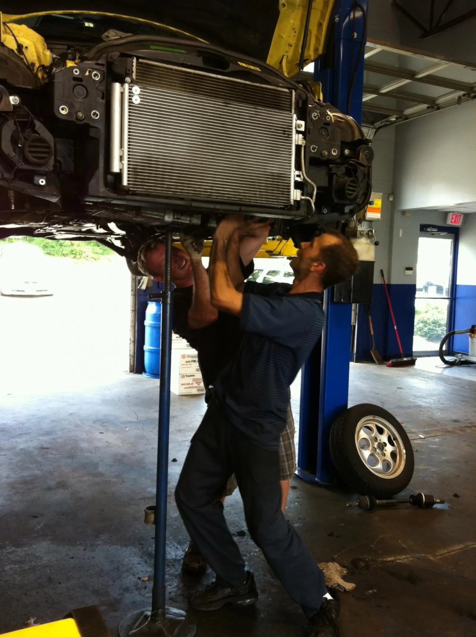 two men working on a car