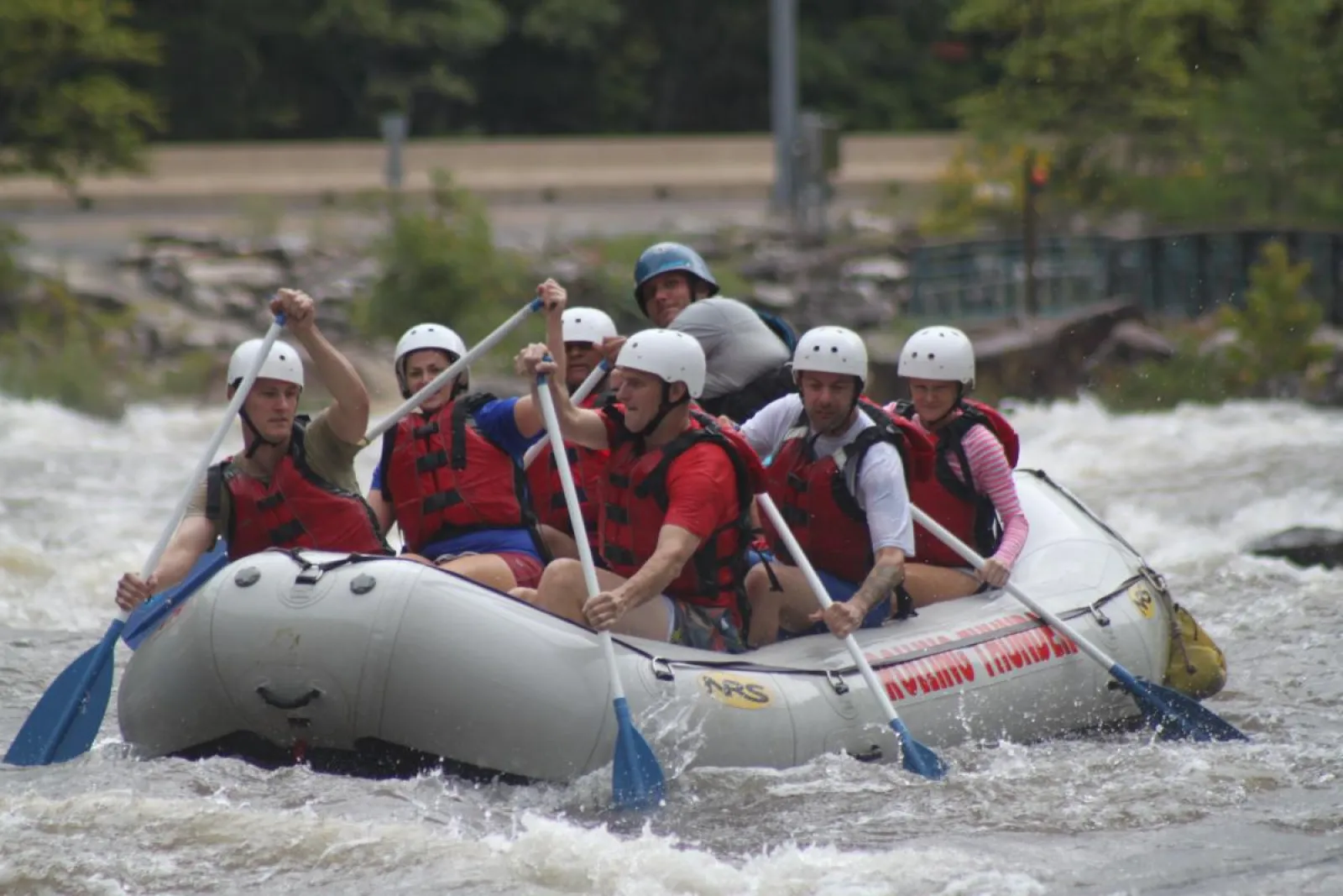 a group of people riding on a raft