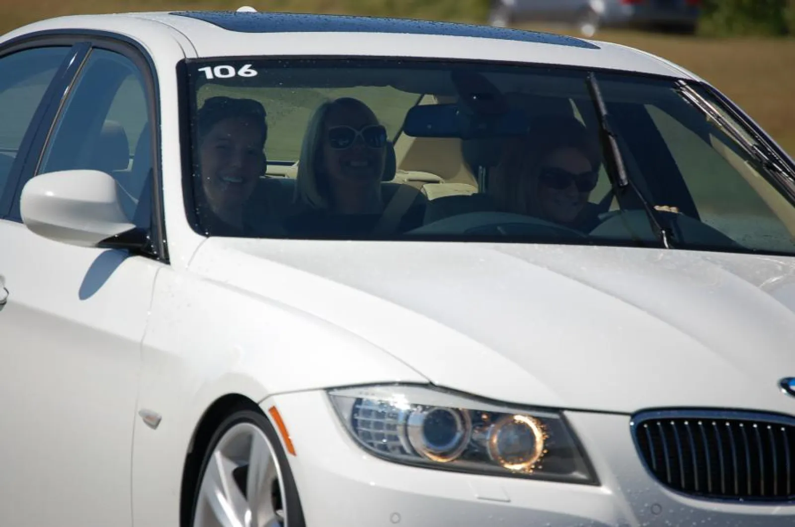 people smiling in a car