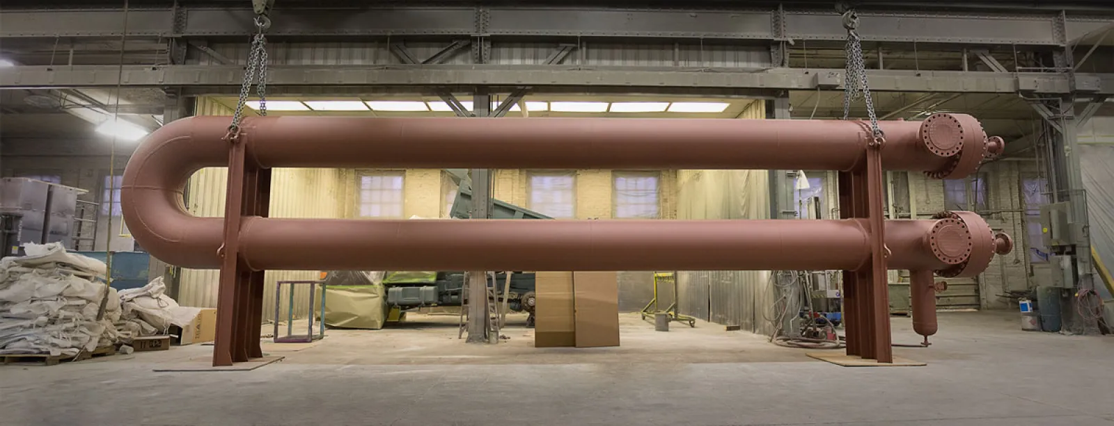 a large metal pipe in a warehouse