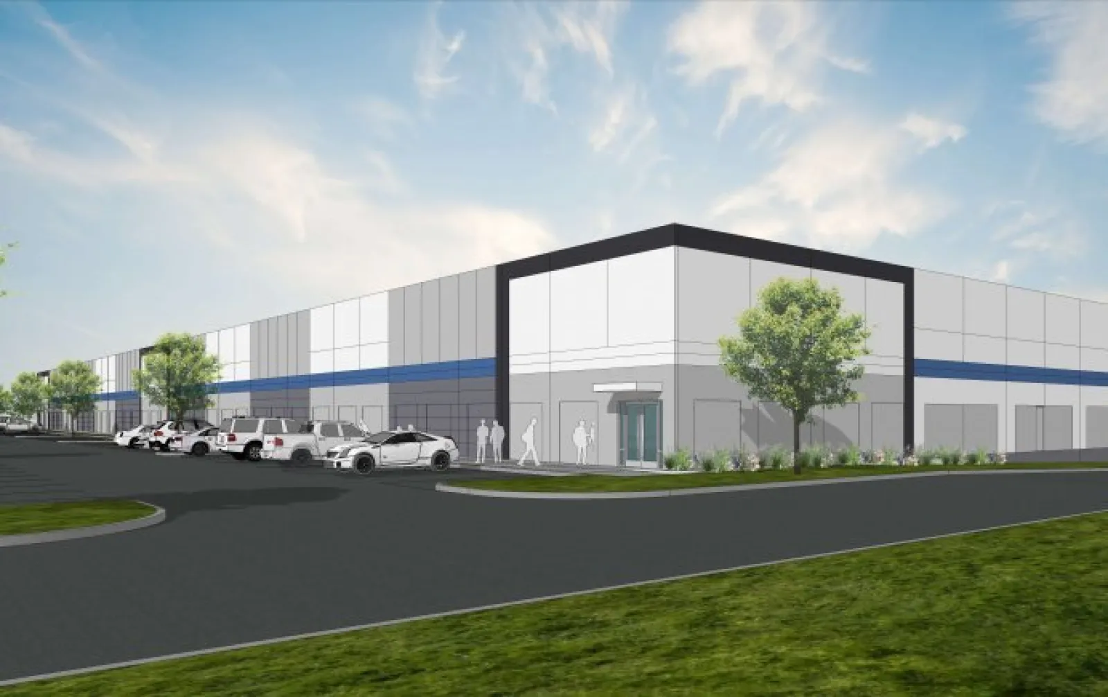 Modern industrial building with parking lot, trees, and clear blue sky in a clean urban area.