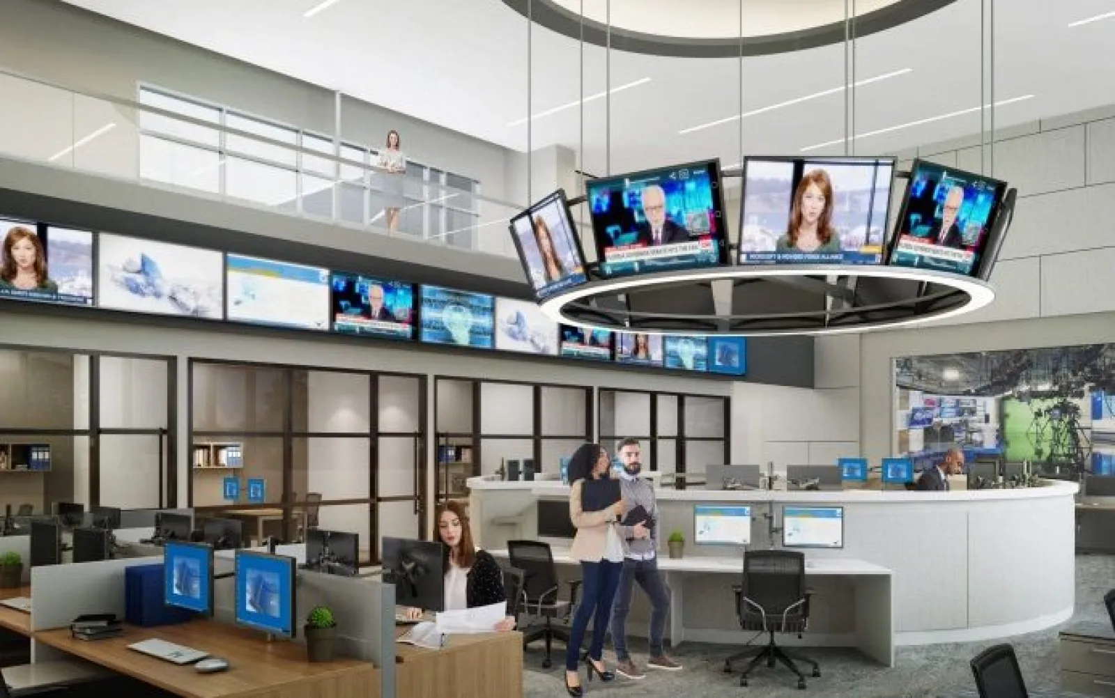 Modern newsroom with multiple monitors, a circular screen display, and staff working at desks and standing.