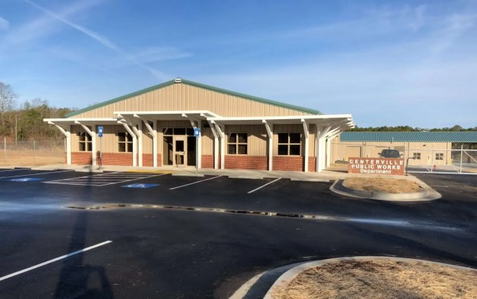 Centerville Public Works Department building with parking lot and clear blue sky in the background