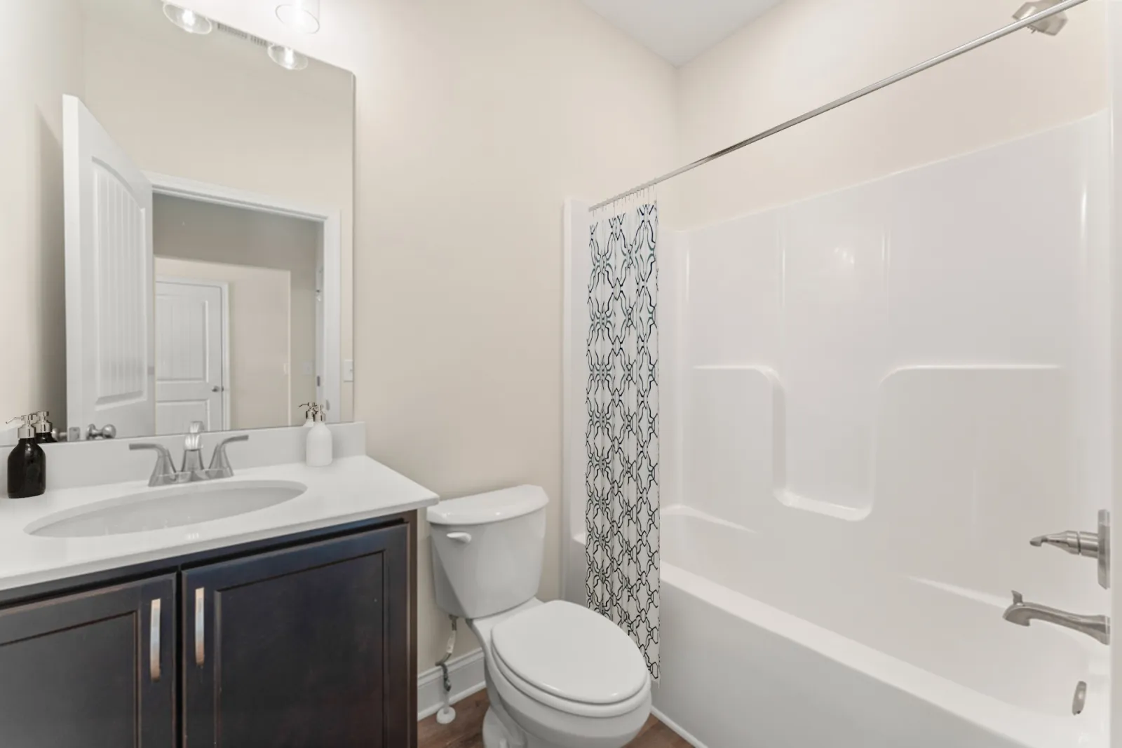 a bathroom with a tub sink and toilet