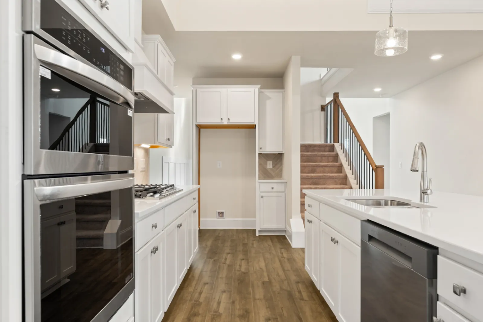 a kitchen with white cabinets