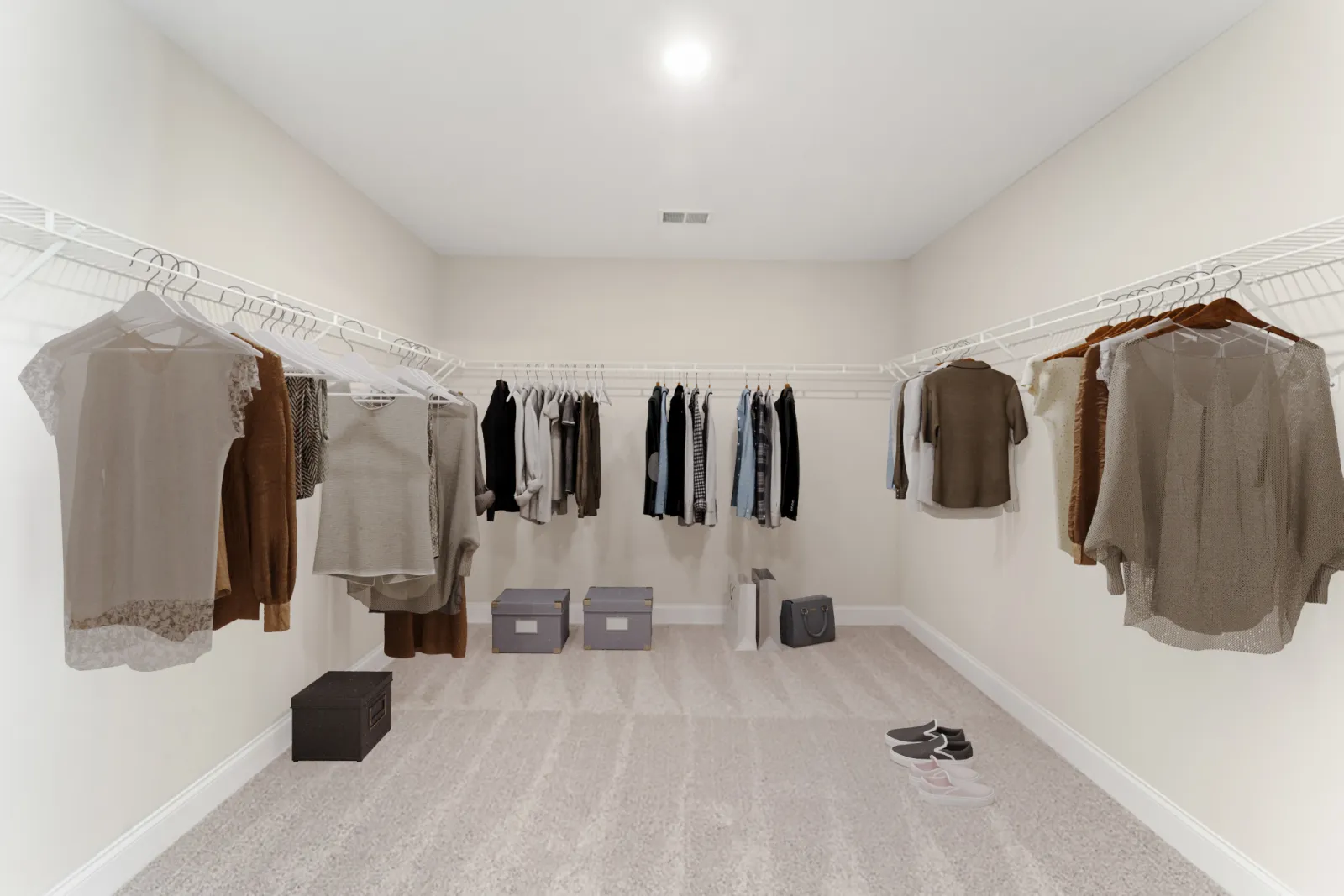 a room with a rack of clothes