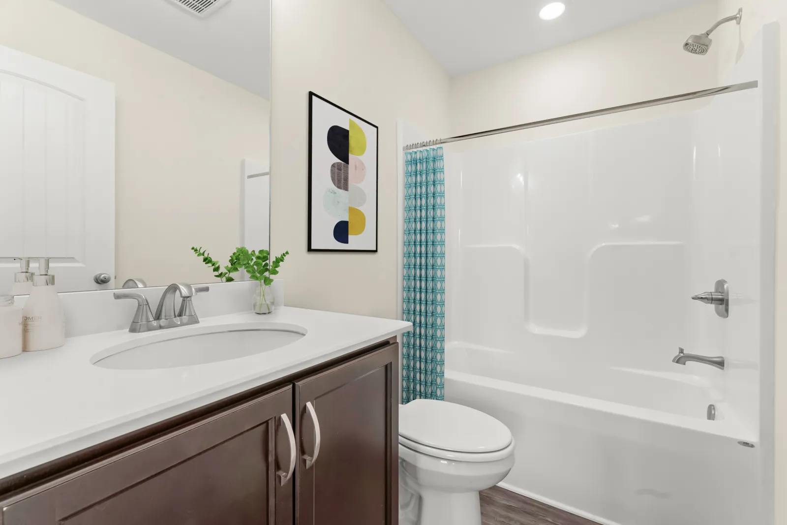 a bathroom with a tub sink and toilet