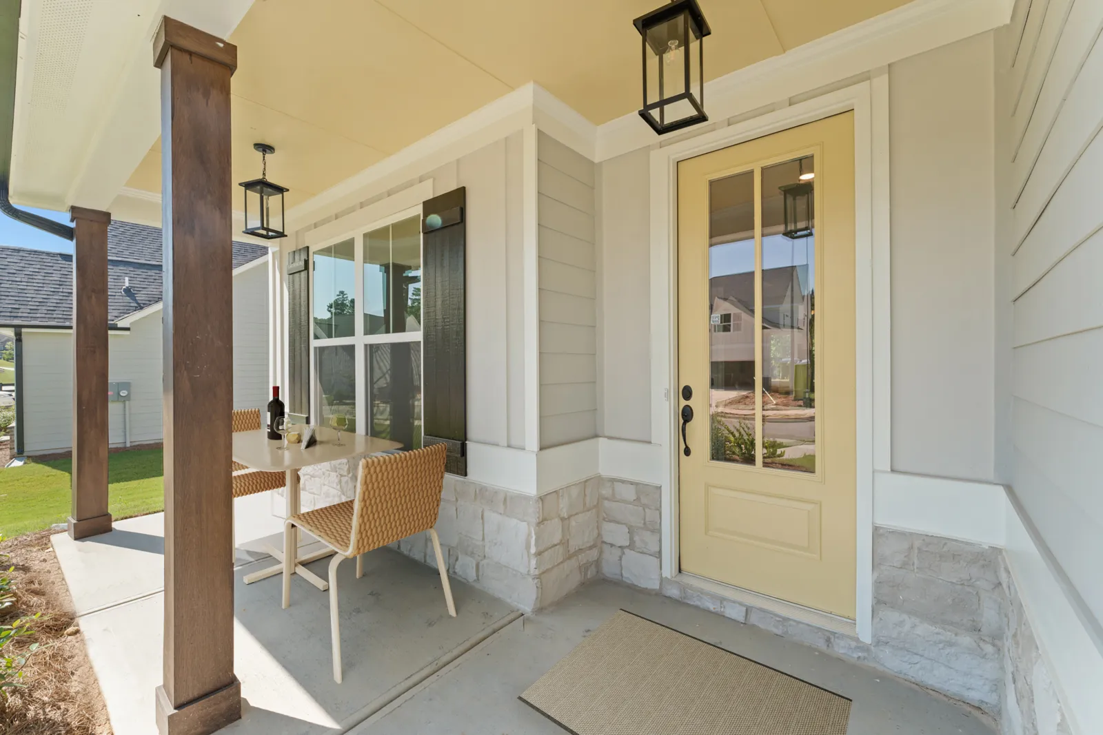 a patio with a table and chairs