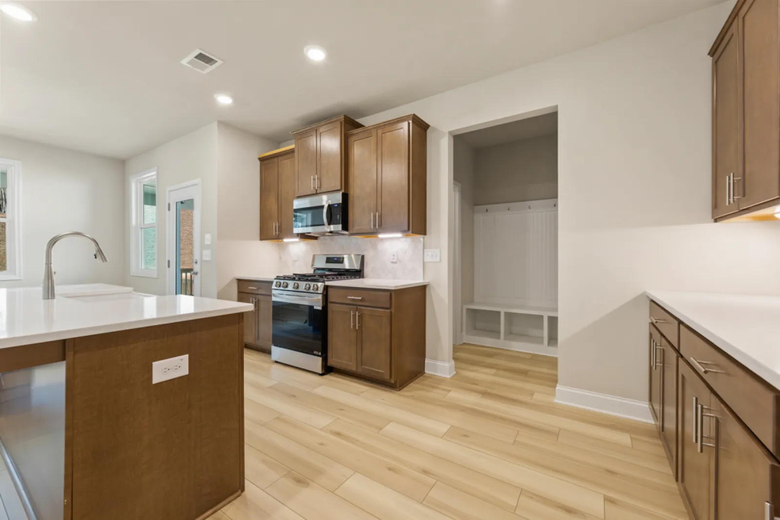 a kitchen with wooden cabinets