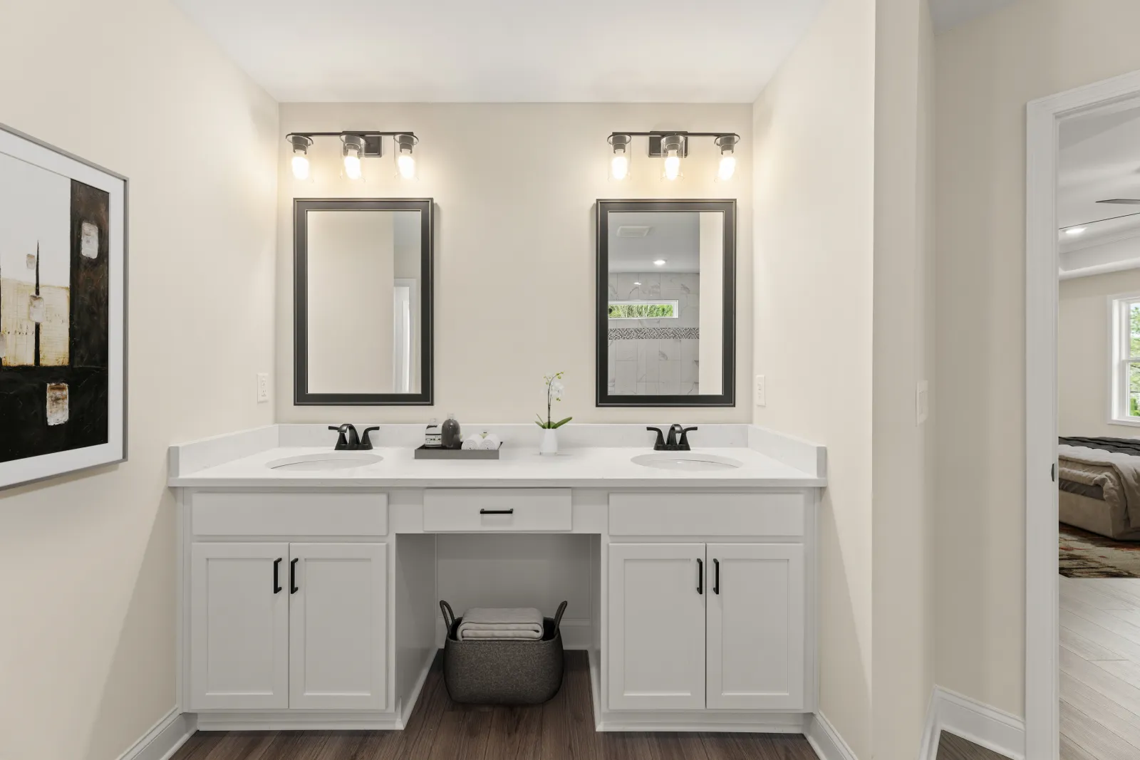 a bathroom with white cabinets