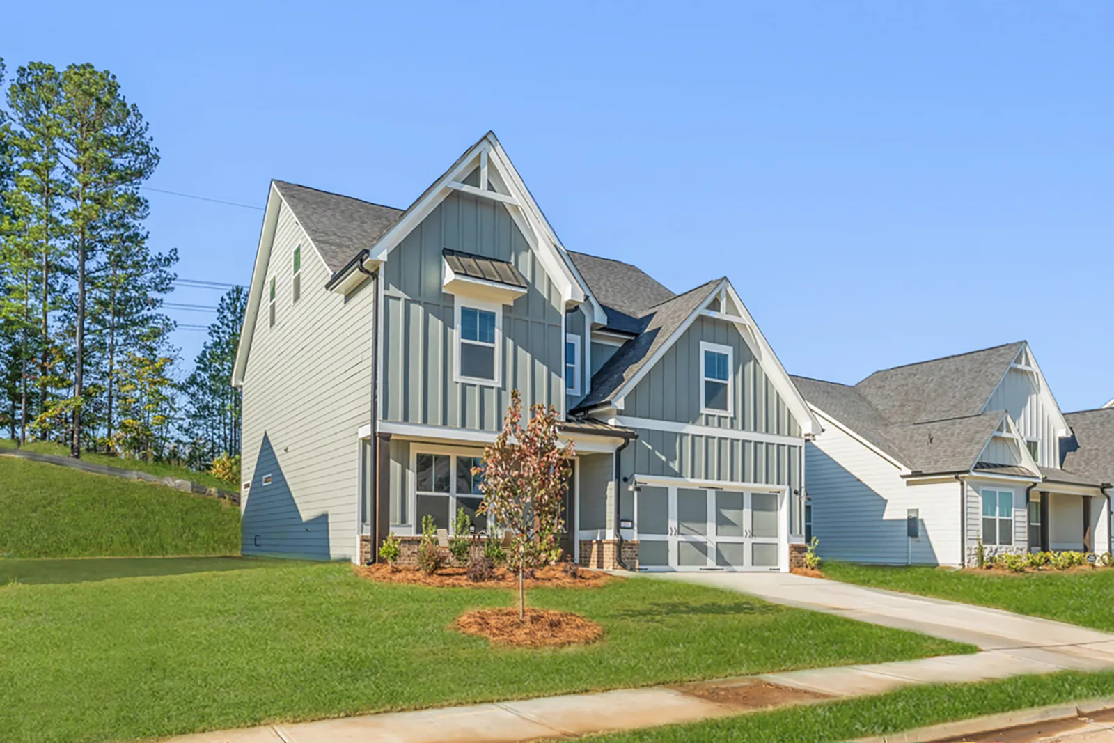 a house with a lawn and trees