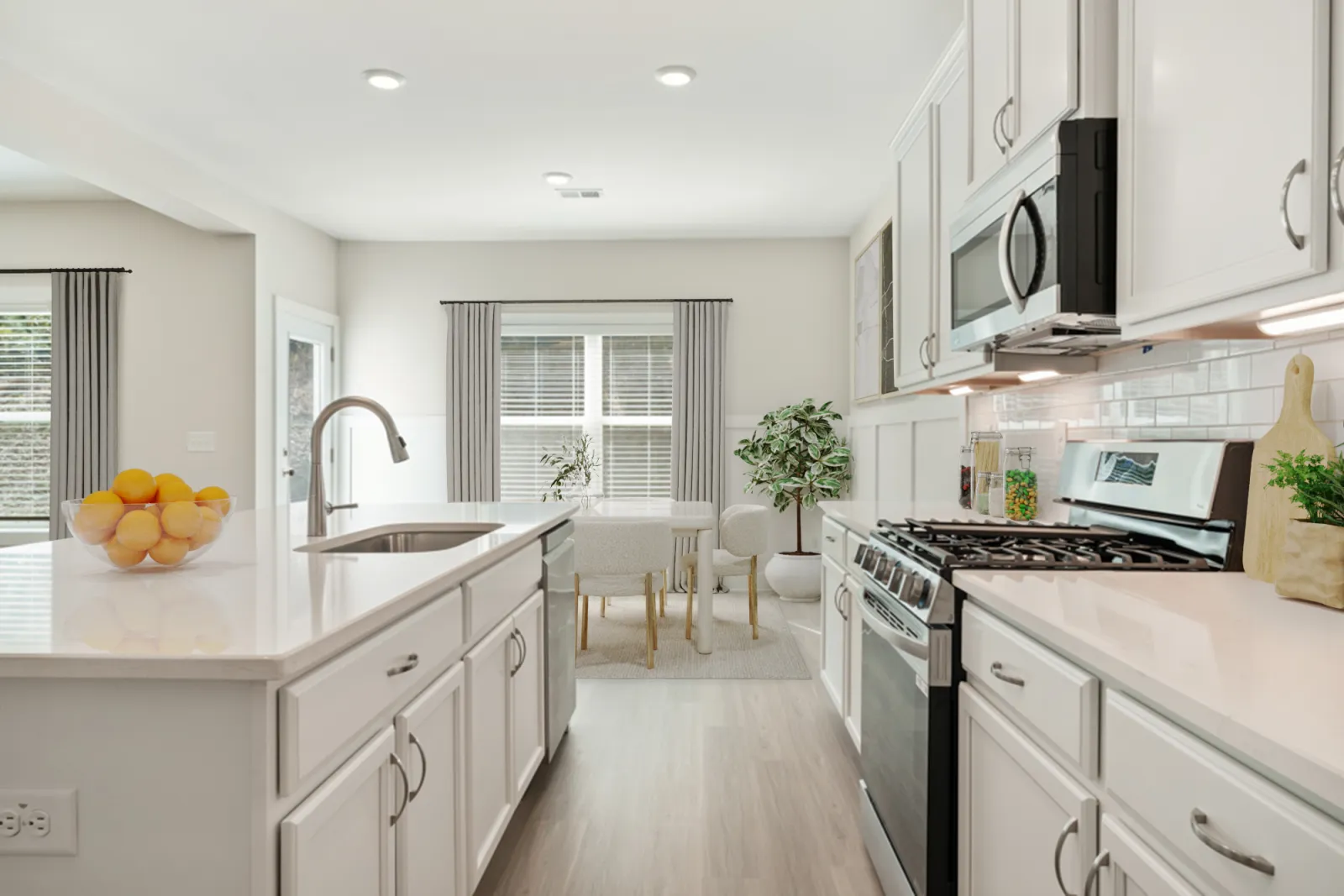 a kitchen with white cabinets