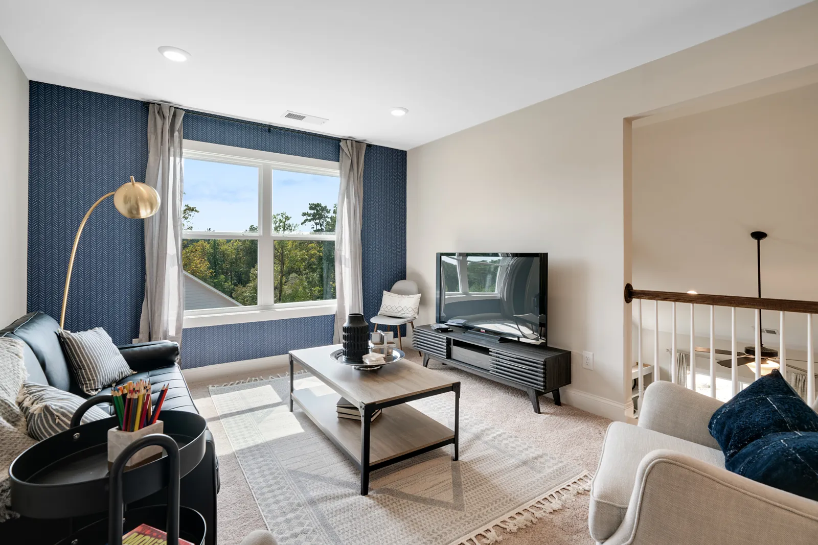 a living room with a tv and couches