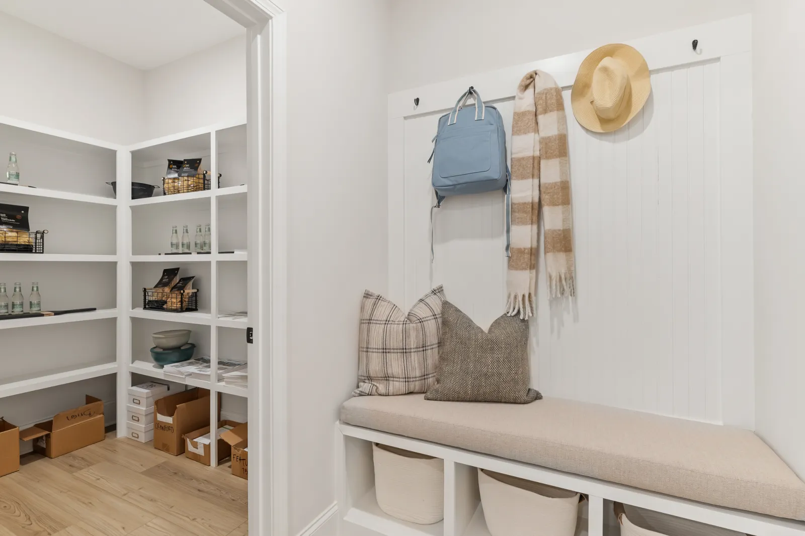 a room with a white table and shelves with objects on it