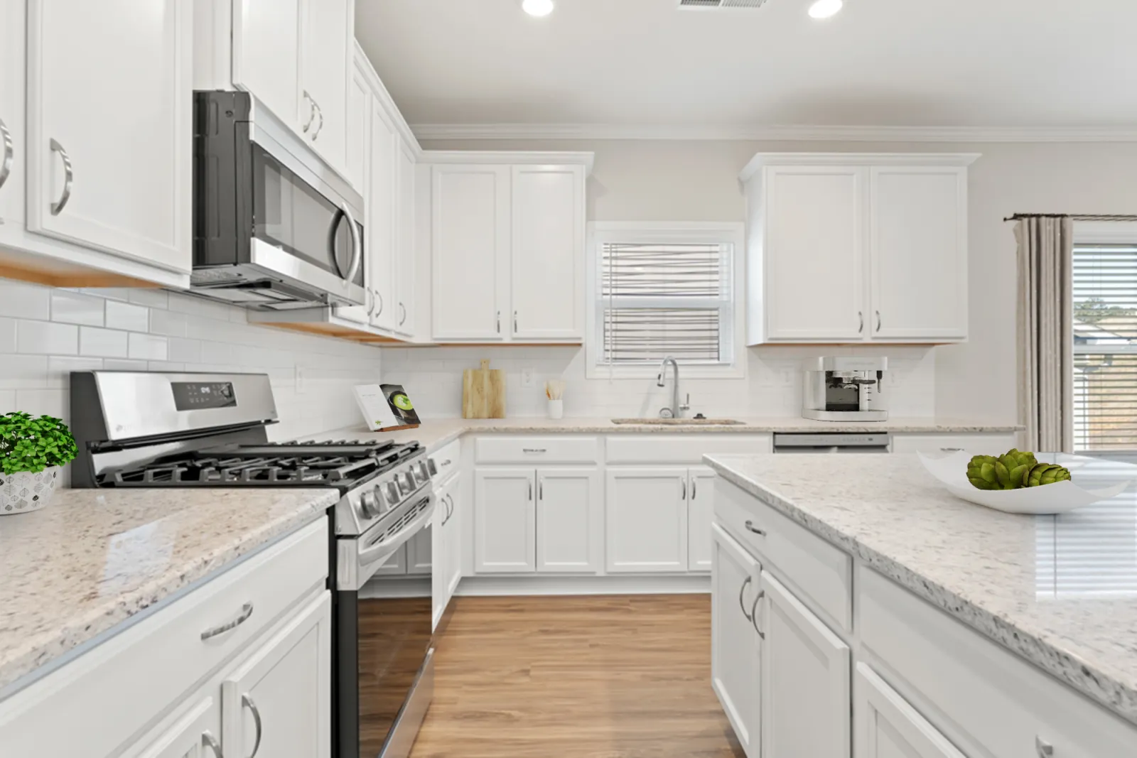 a kitchen with white cabinets