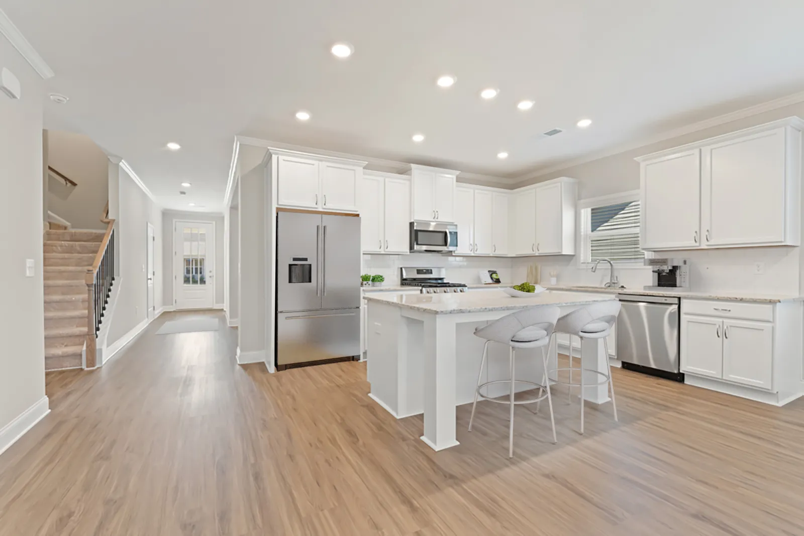 a kitchen with white cabinets