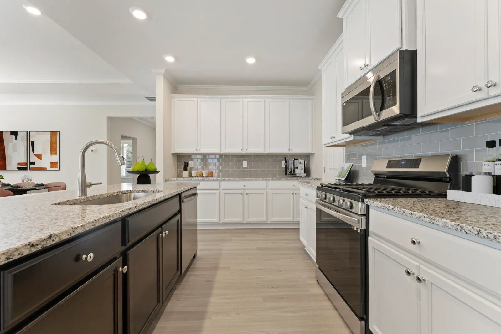 a kitchen with white cabinets