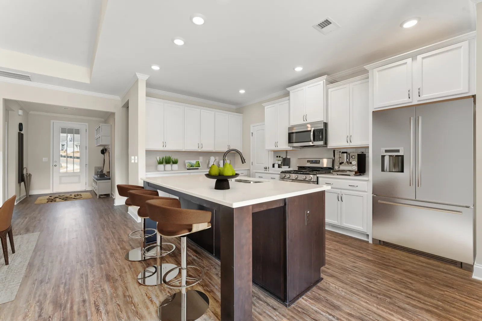 a kitchen with white cabinets