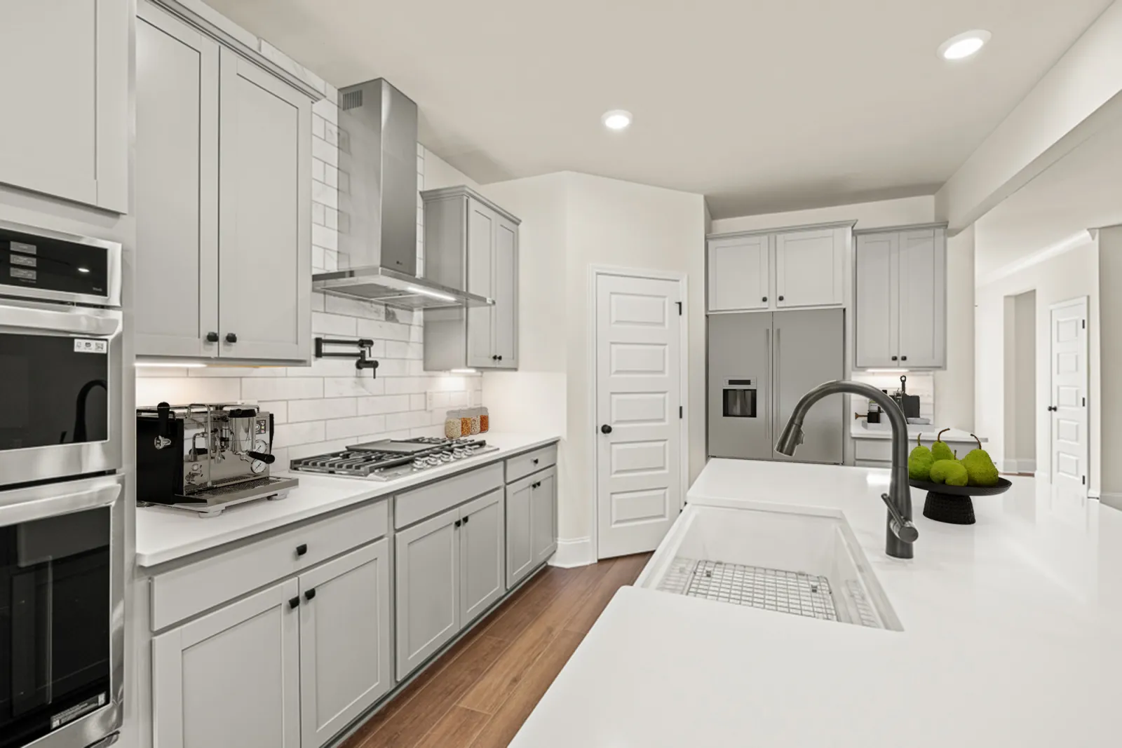 a kitchen with white cabinets