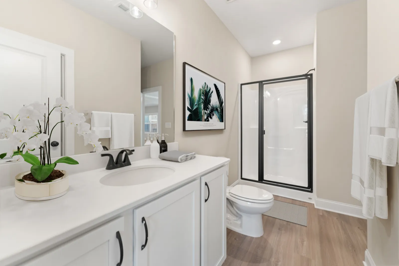 a bathroom with white cabinets