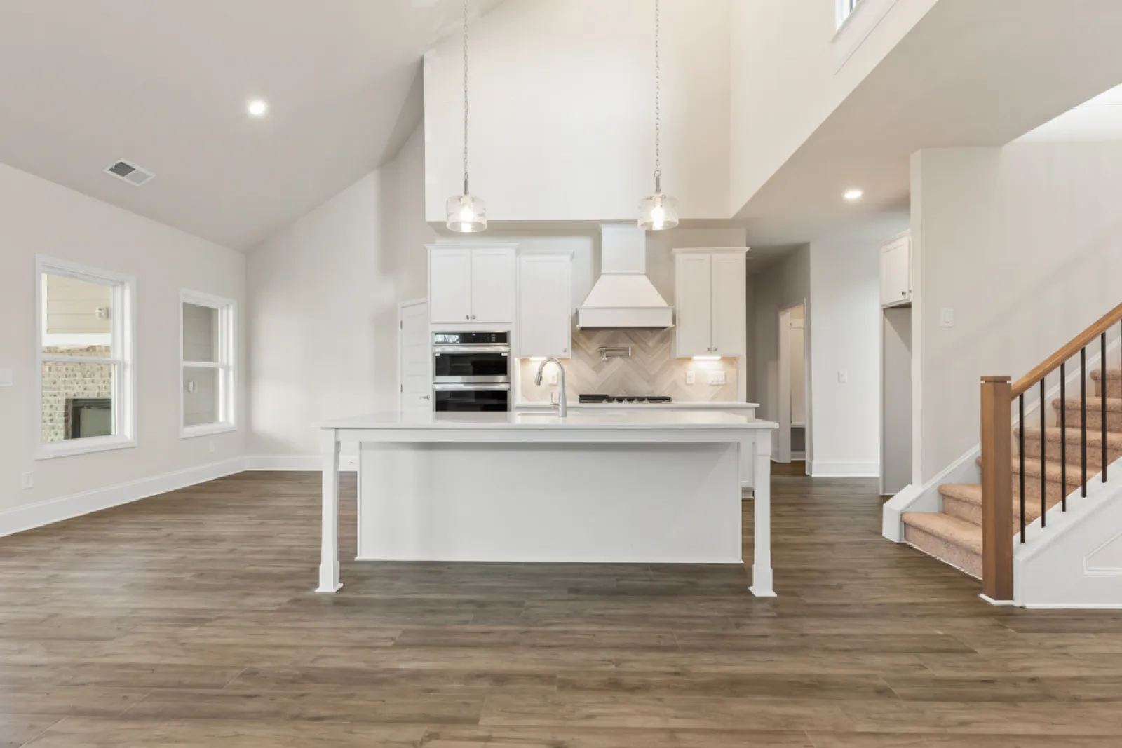 a kitchen with white cabinets