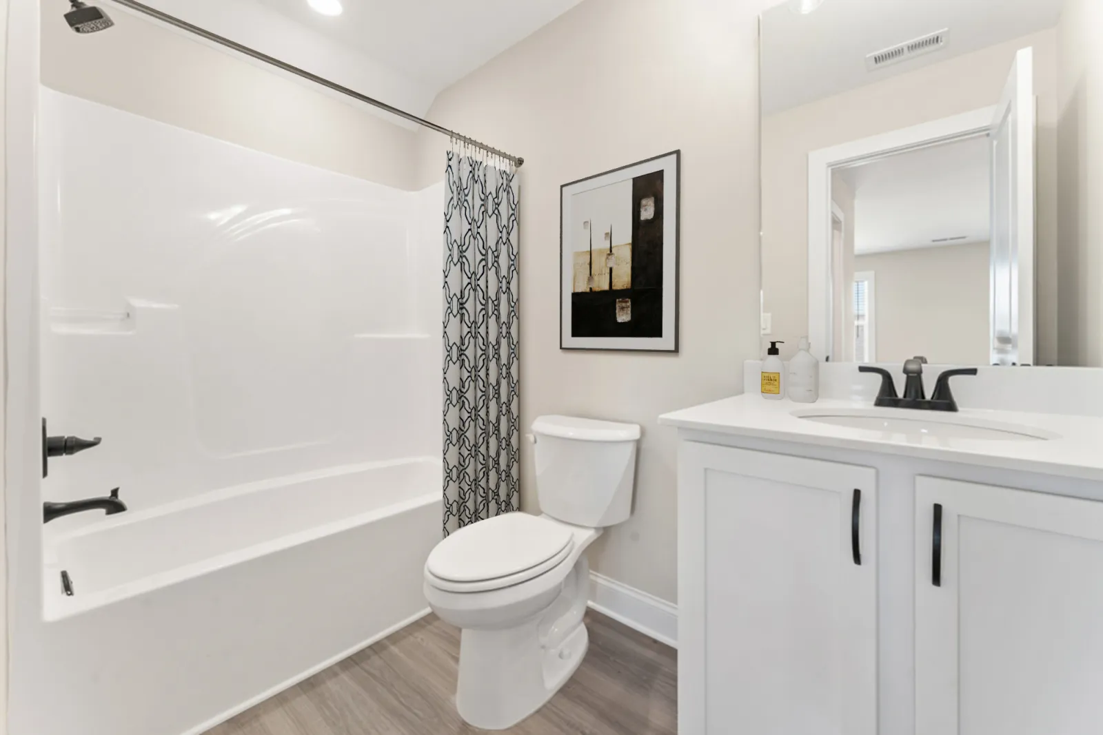 a bathroom with a tub toilet and sink