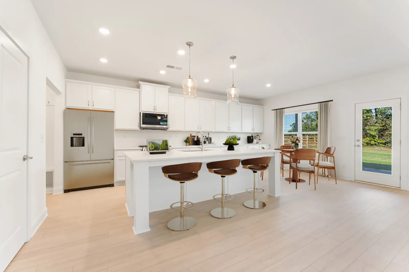 a kitchen with white cabinets