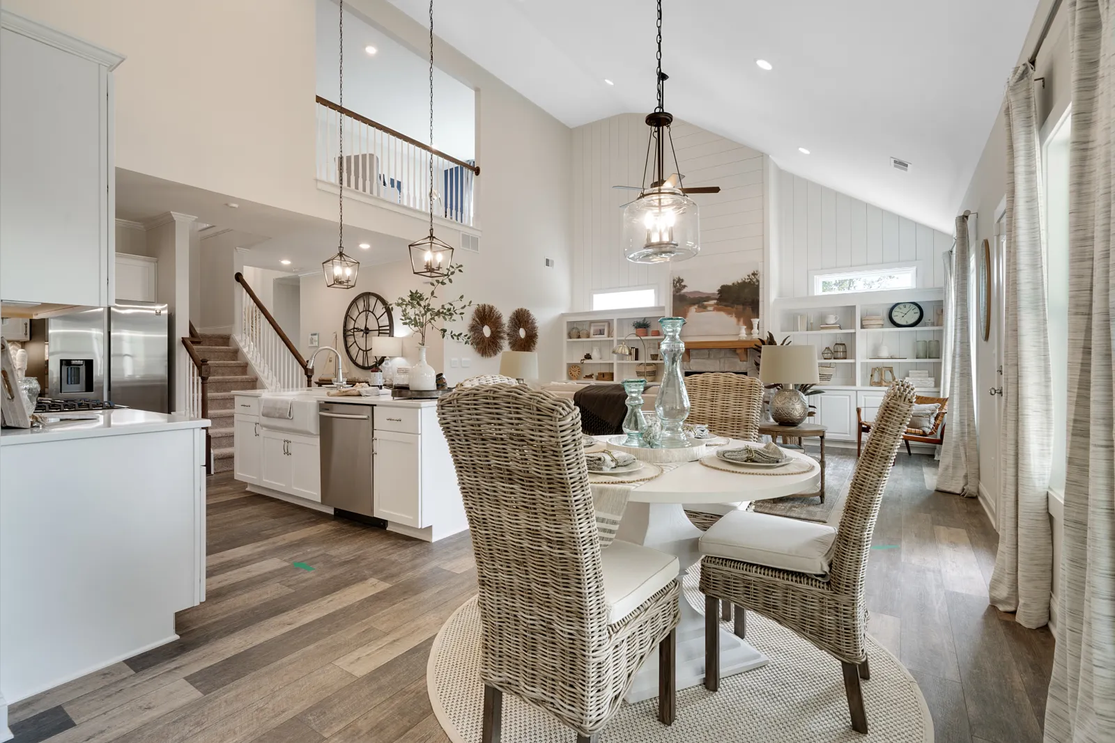 a kitchen with a dining table and chairs