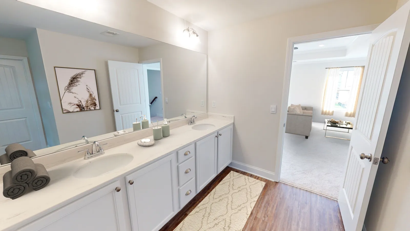 a bathroom with white cabinets