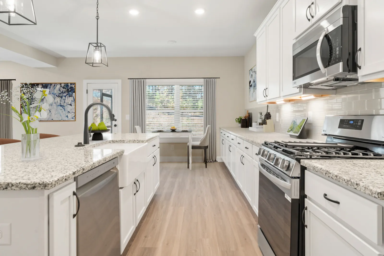 a kitchen with white cabinets