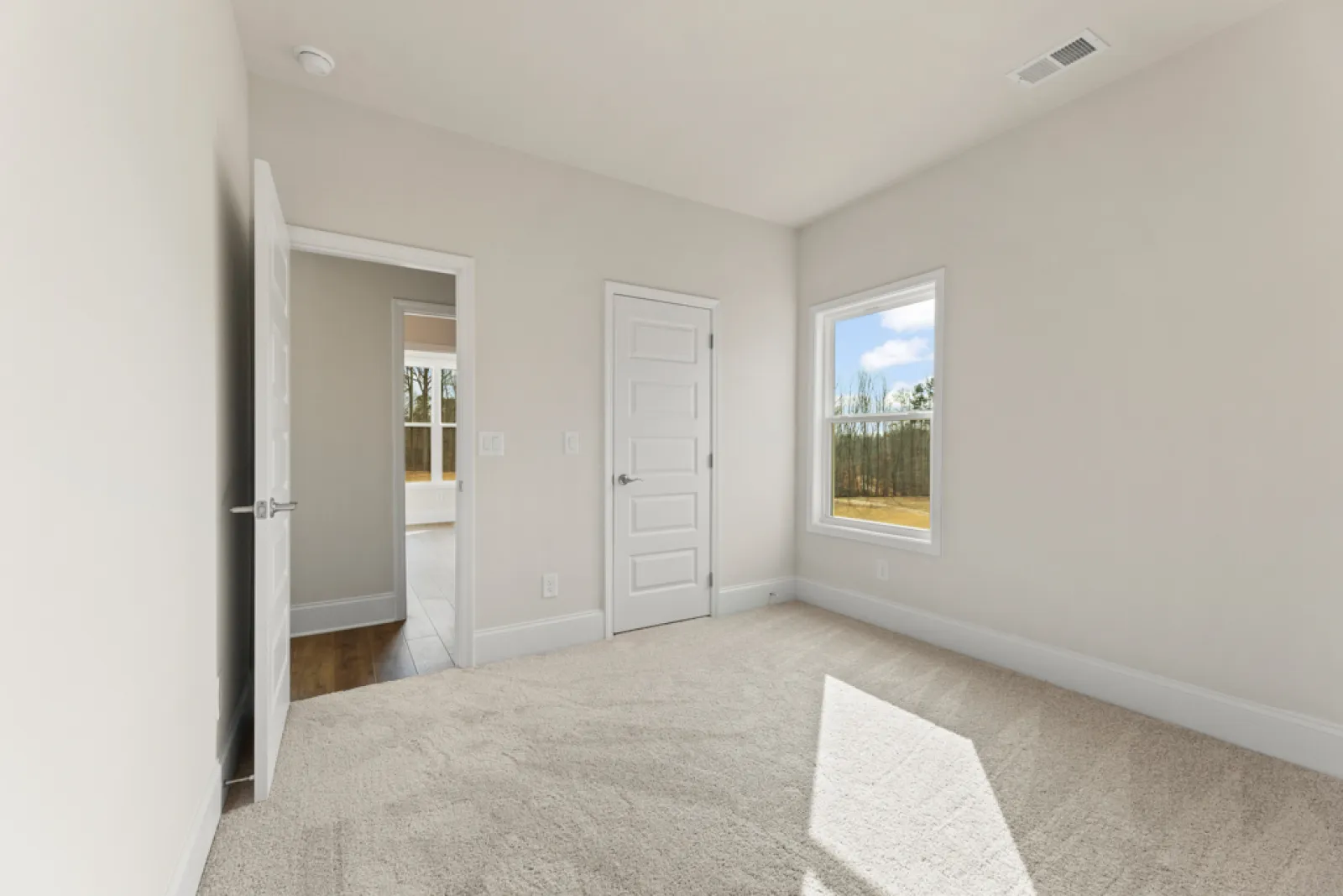 a hallway with white doors