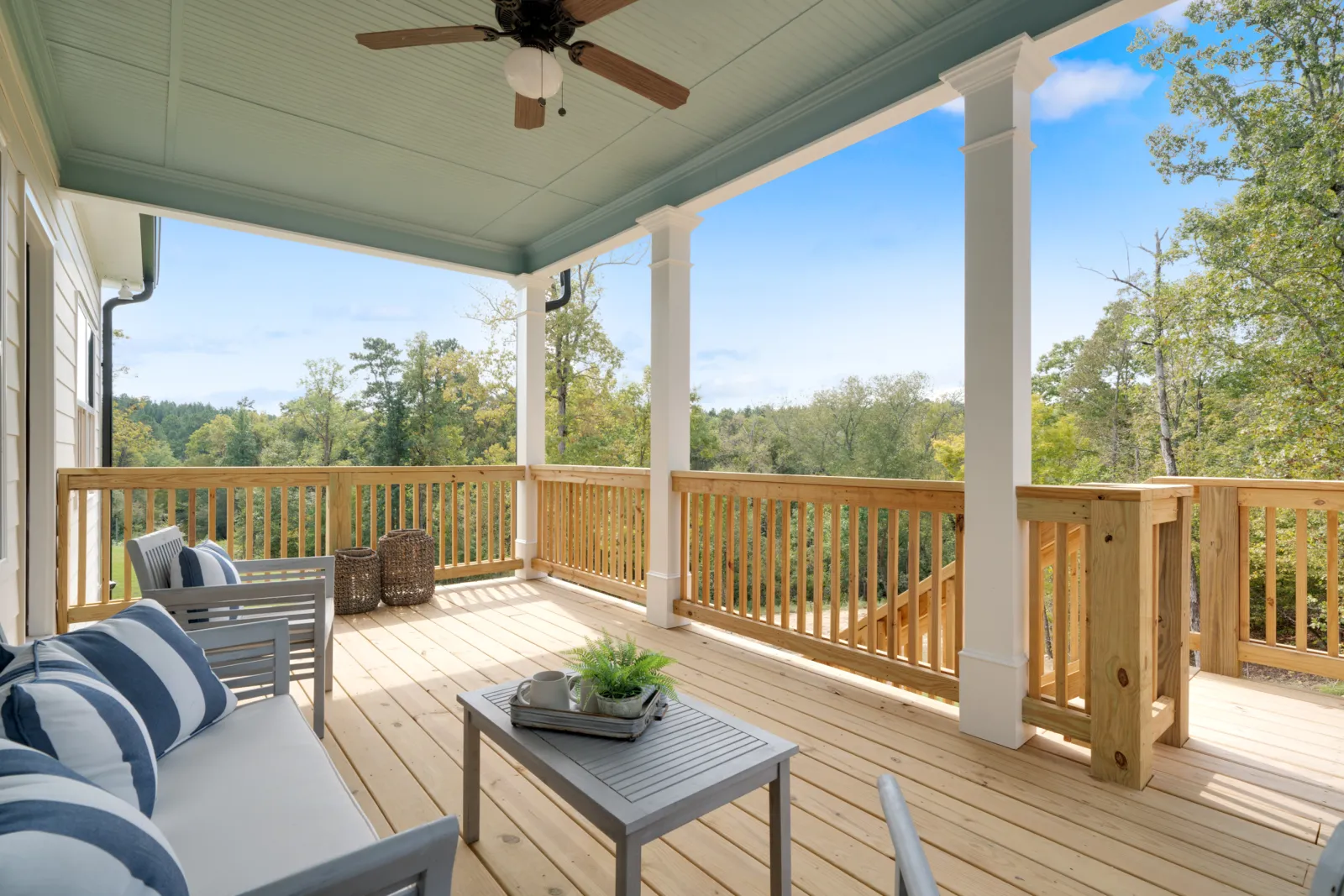 a deck with a table and chairs