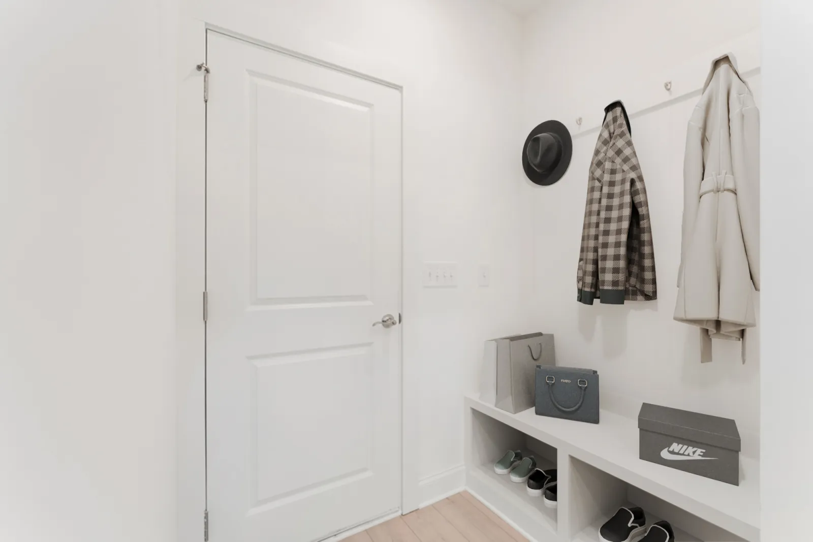 a closet with a towel rack and a door