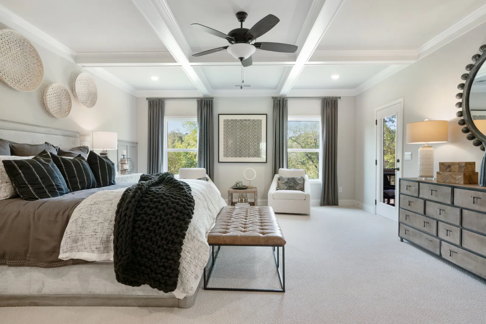 a bedroom with a bed and a fan