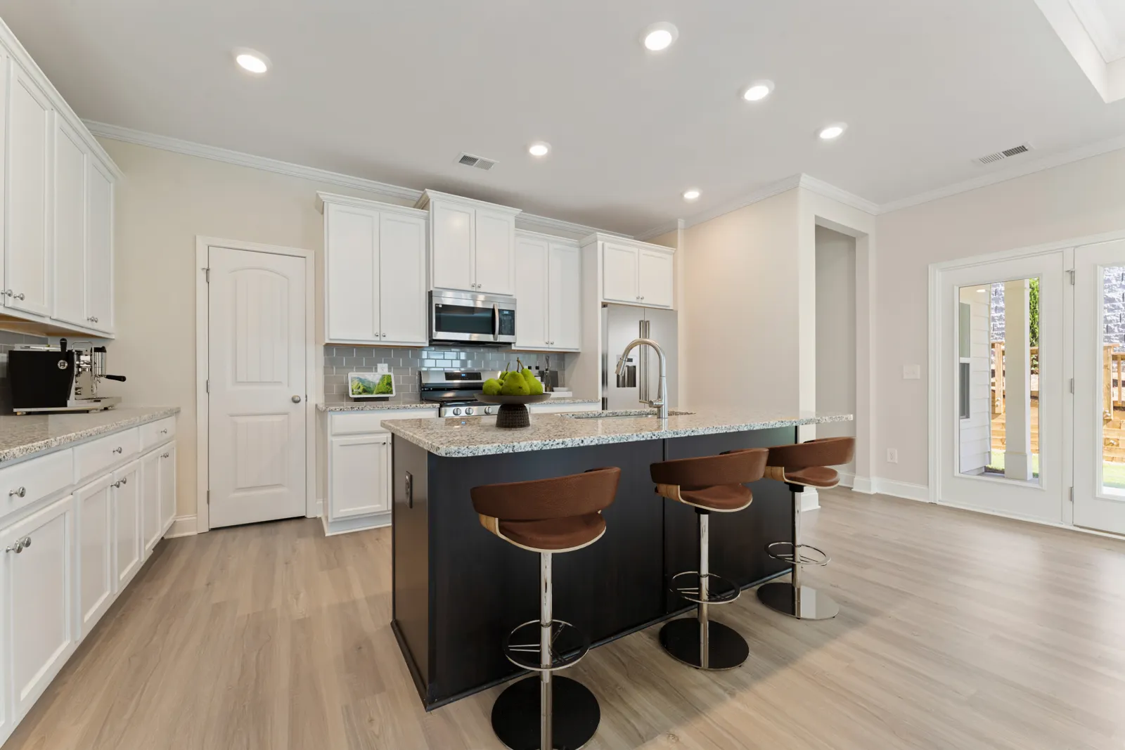 a kitchen with white cabinets