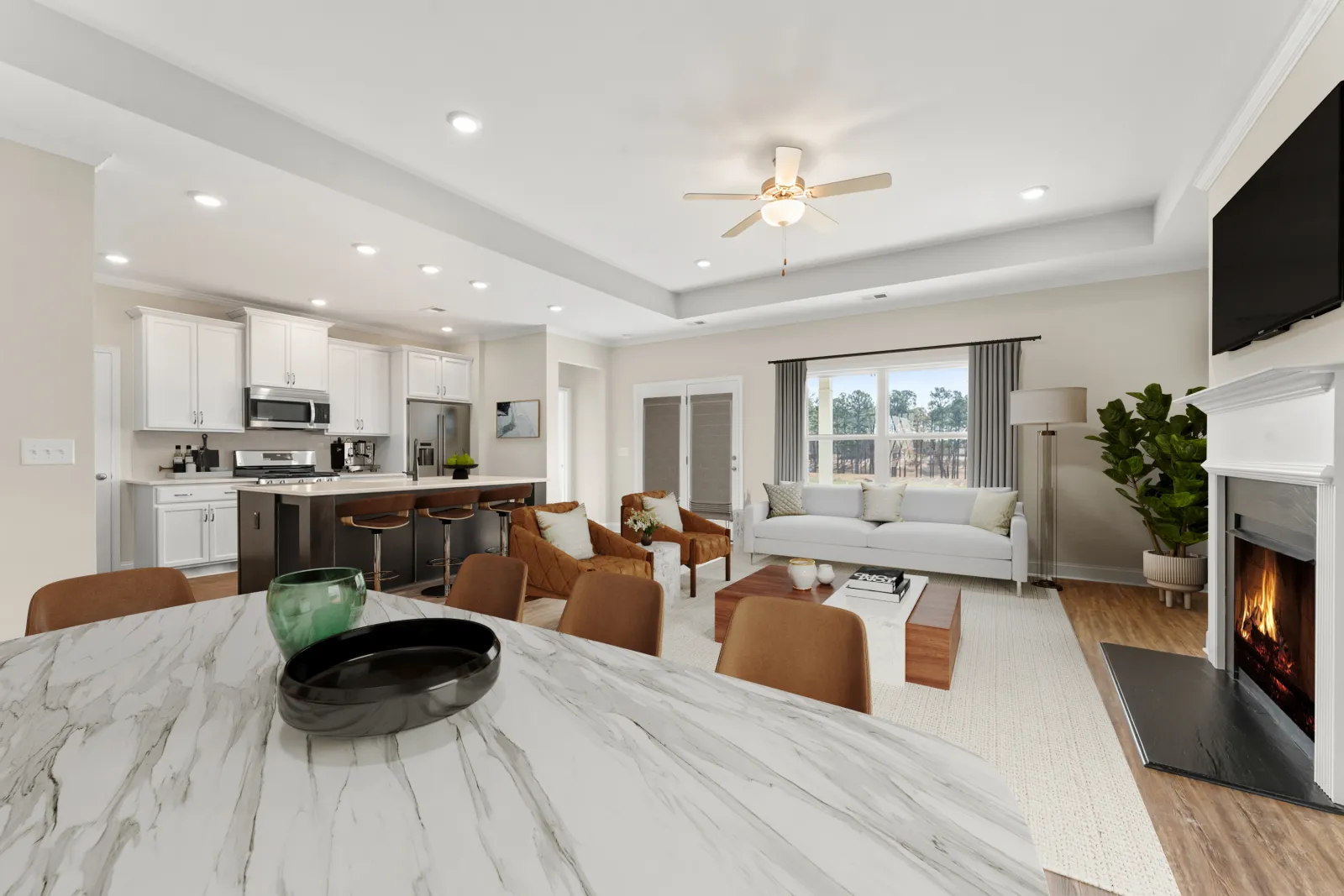 a large living room with a large white table and a large white couch